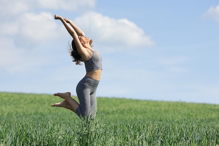 Healthy woman in green field